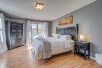 Bedroom 5 on second floor with King bed and windows overlooking Keuka Lake